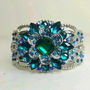 NWOT Versona Silver with teal flower women's bracelet. Hinge closure.